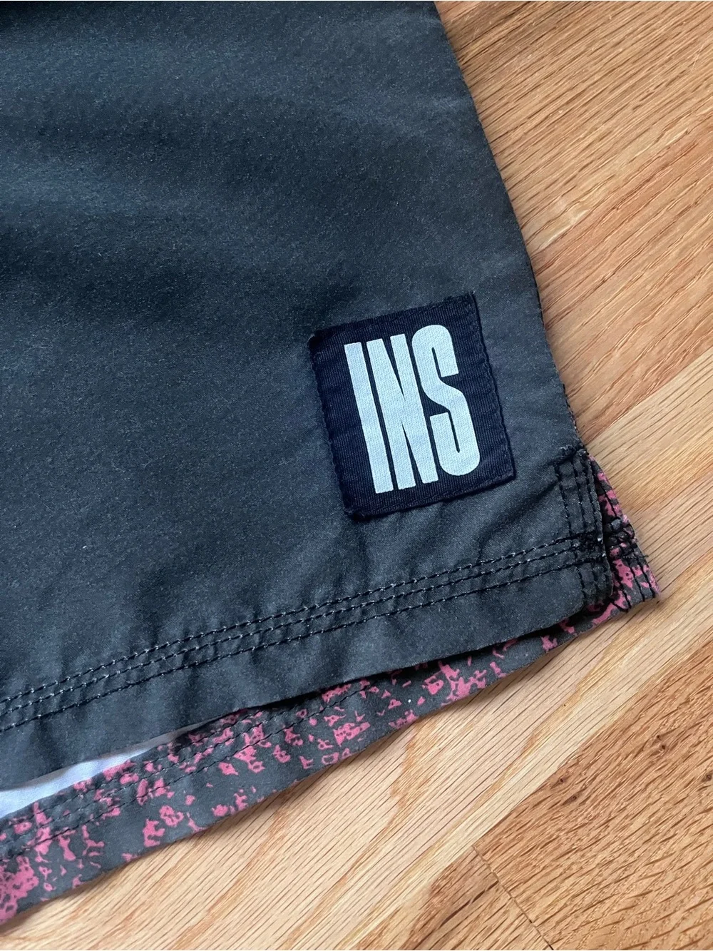 Insight Men’s Black Swim Shorts with Red Speckle Panel